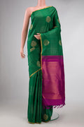 Pure Silk Pure Zari Green Dual Tone Kanchipuram Saree with Stripes on the body and Zari Border displayed on a mannequin