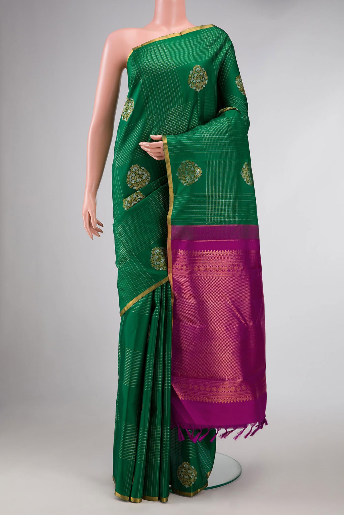 Pure Silk Pure Zari Green Dual Tone Kanchipuram Saree with Stripes on the body and Zari Border displayed on a mannequin