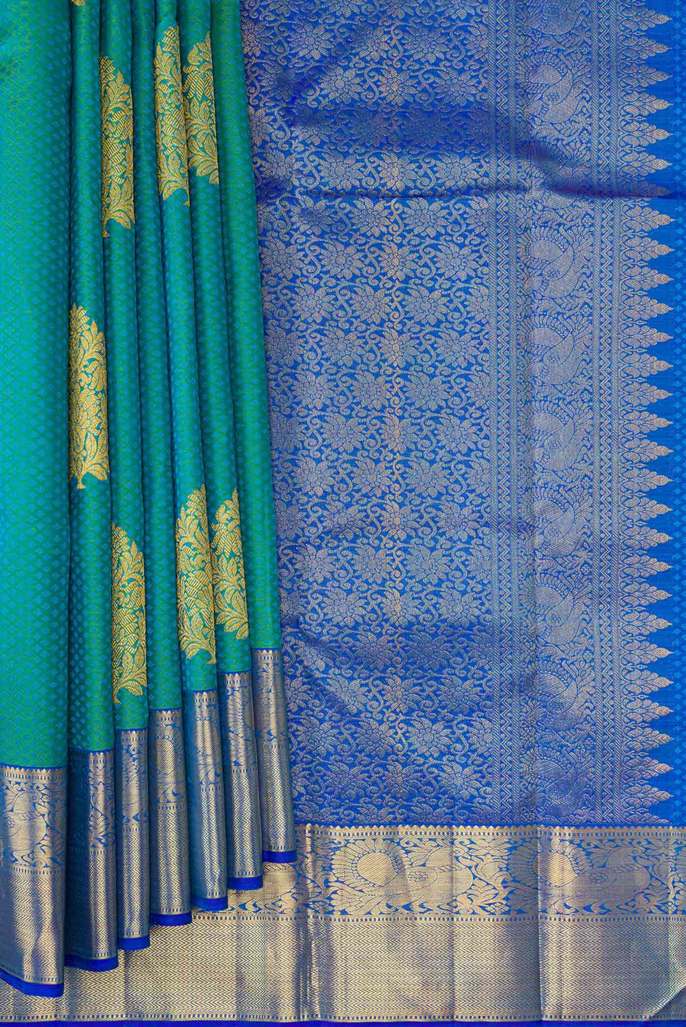 Pleats and pallu of Green Dual Tone Kanchipuram Silk Saree with Jacquard With Zari Butta on the body and Zari Border. 