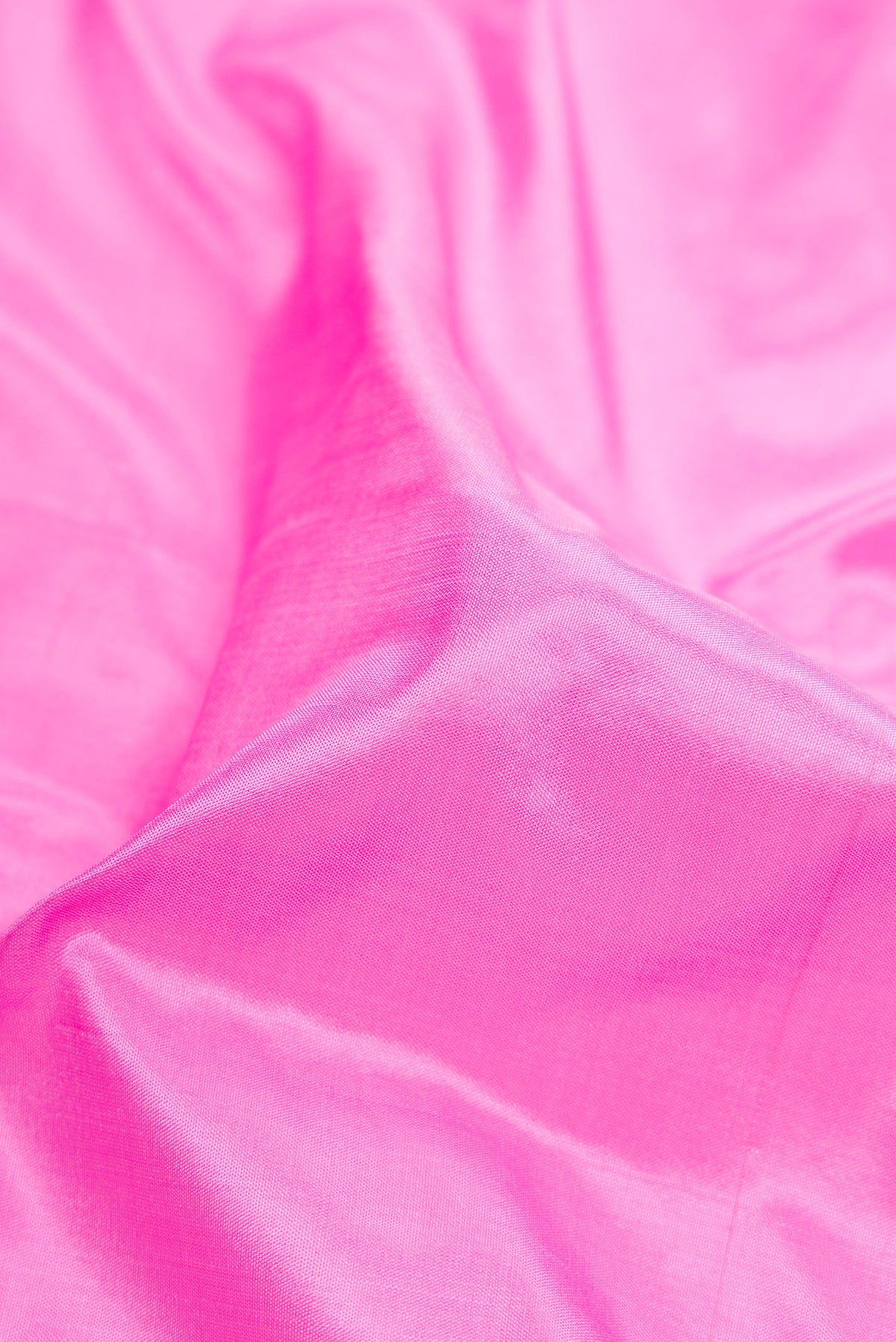 Close up of Pink Dual Tone Kanchipuram Silk Nine Yards Saree with Plain Body and Zari Border.  displaying folds