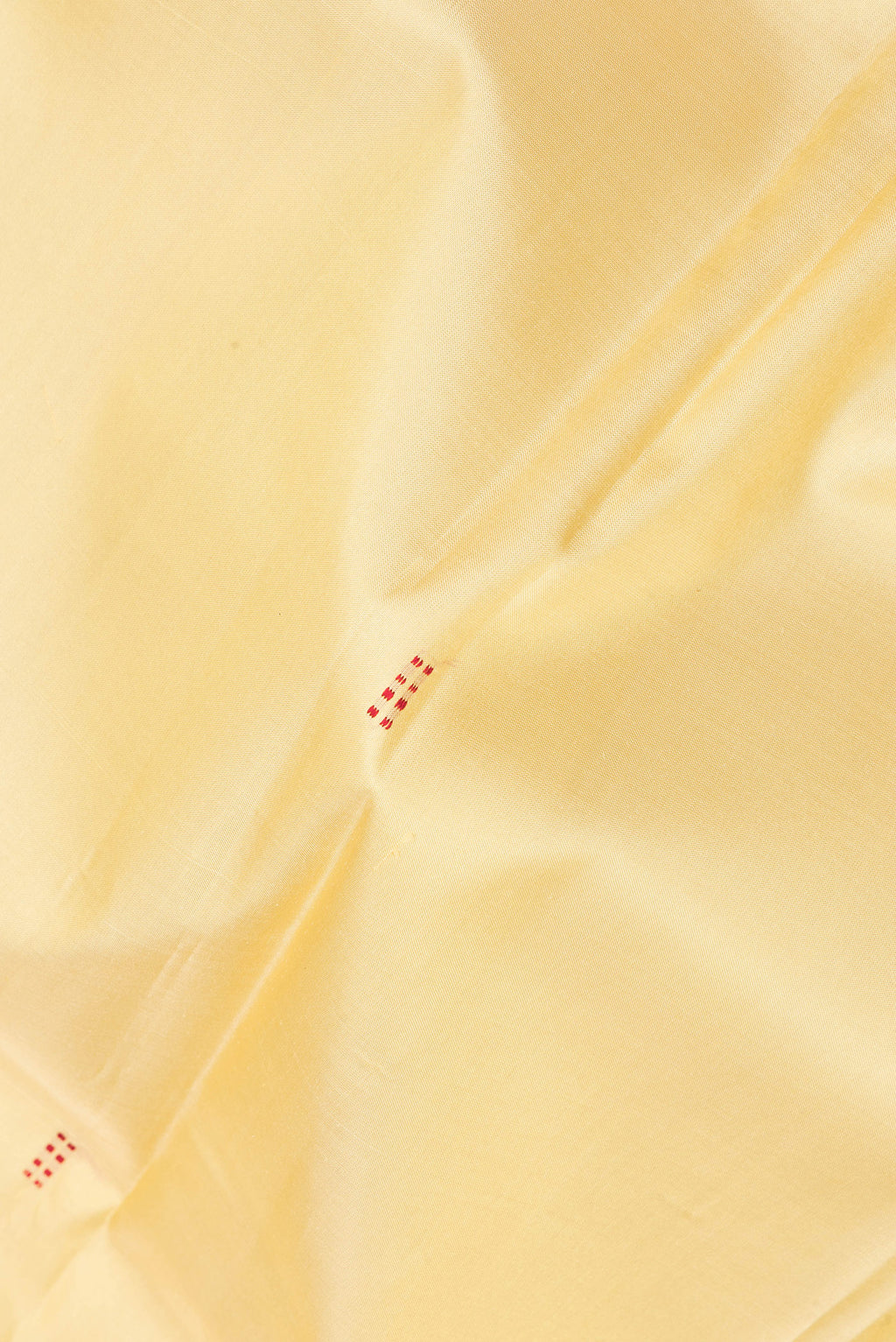 Close up of Pure Silk Sandal Kanchipuram Saree with Thread Butta on the body and Thread Border.  displaying folds