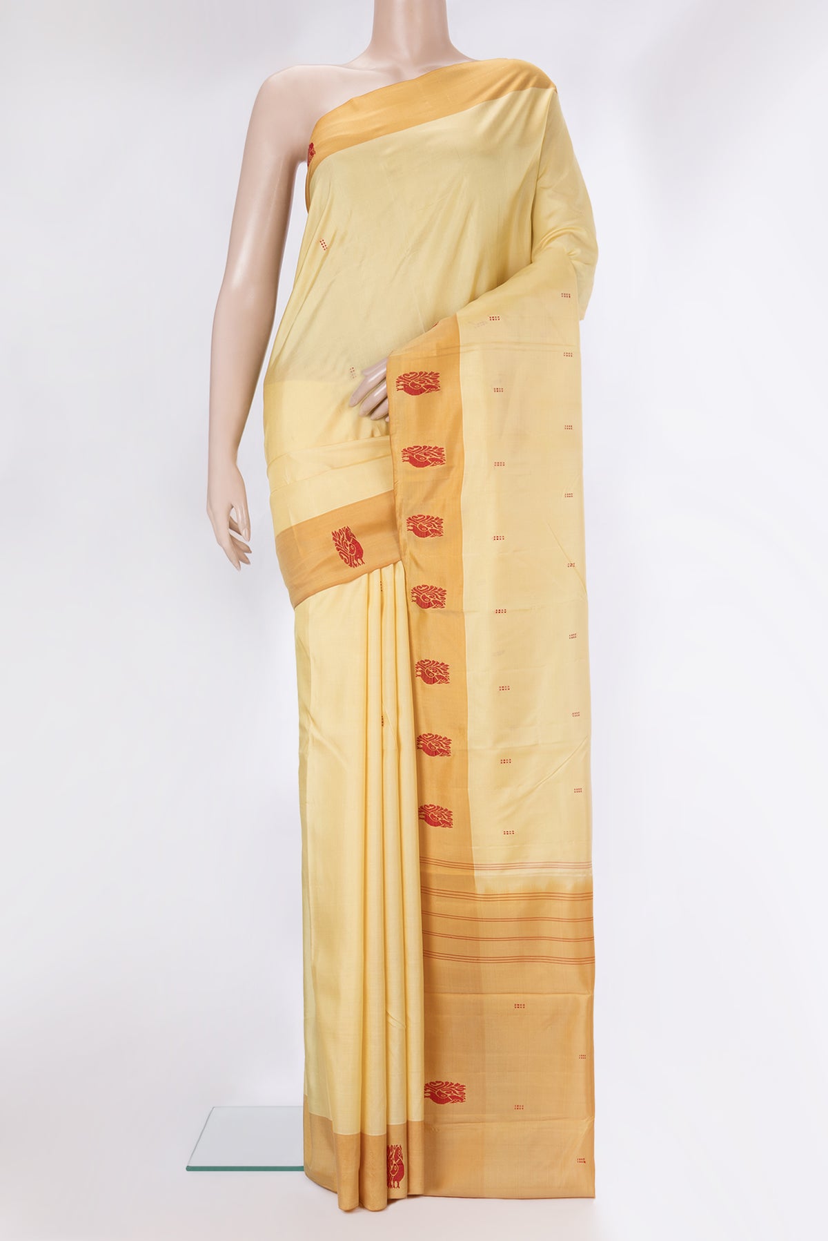 Pure Silk Sandal Kanchipuram Saree with Thread Butta on the body and Thread Border.  displayed on a mannequin