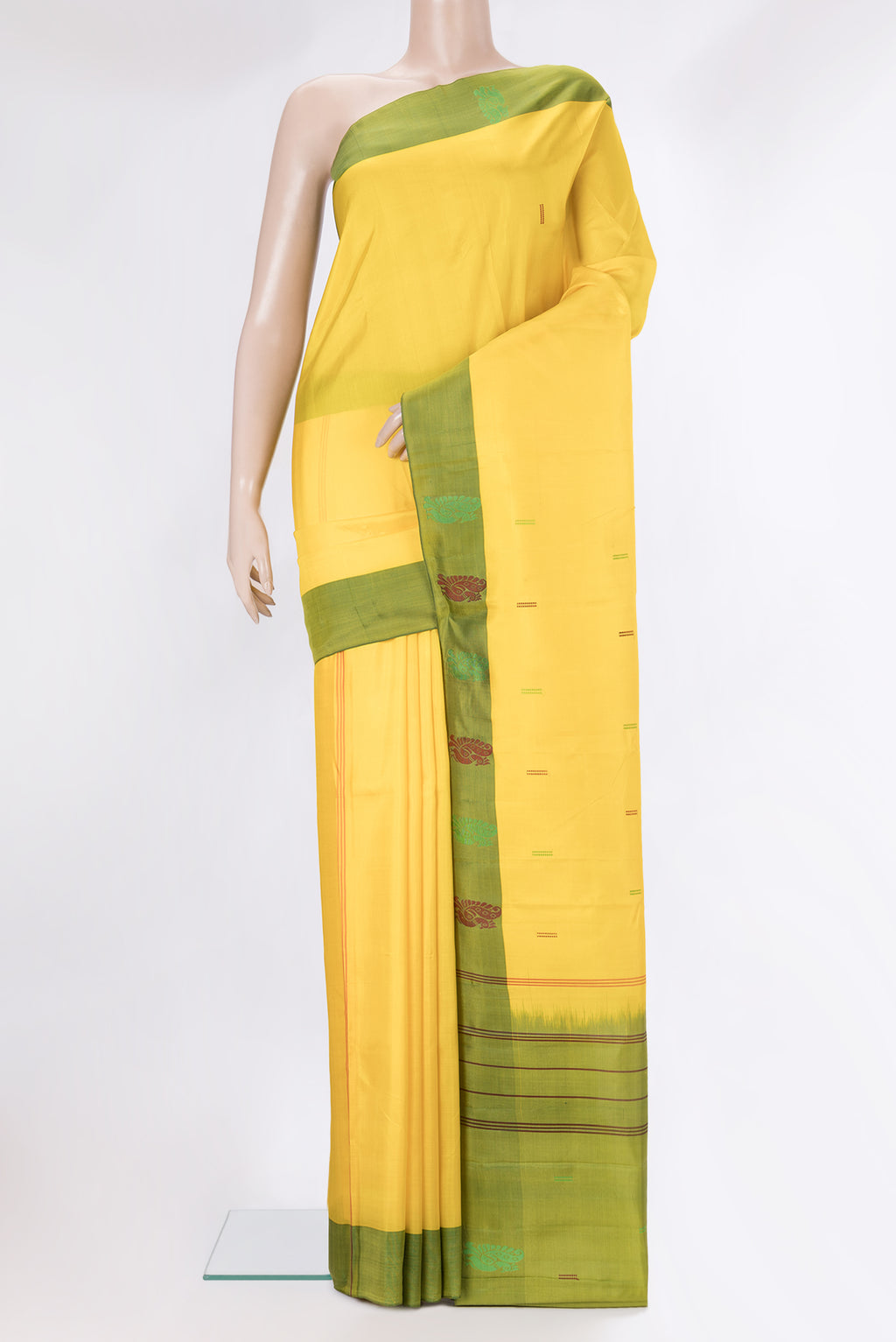 Pure Silk Yellow Kanchipuram Saree with Thread Butta on the body and Thread Border.  displayed on a mannequin