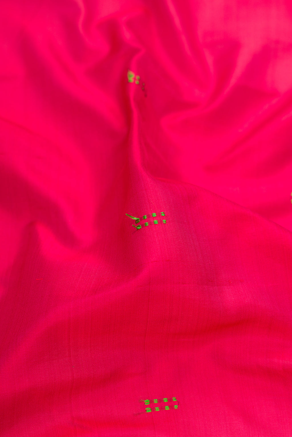 Close up of Maroon Kanchipuram Silk Saree with Thread Butta on the body and Fancy Border.  displaying folds