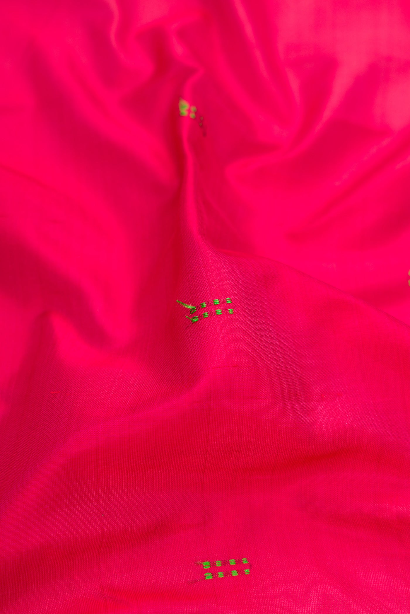 Close up of Maroon Kanchipuram Silk Saree with Thread Butta on the body and Fancy Border.  displaying folds
