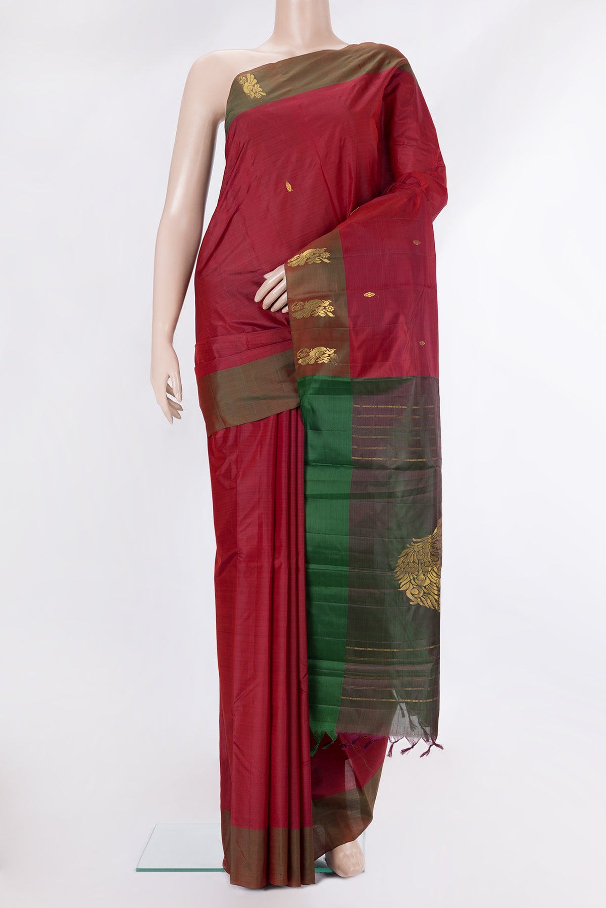 Pure Silk Deep Red Kanjivaram Saree with Zari Butta on the body and Fancy Border.  displayed on a mannequin