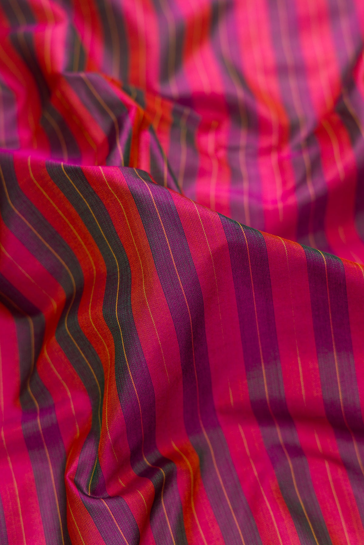 Close up of Pure Silk Pure Zari Purple Dual Tone Kanchipuram Nine Yards Saree with Stripes on the body and Zari Border.  displaying folds