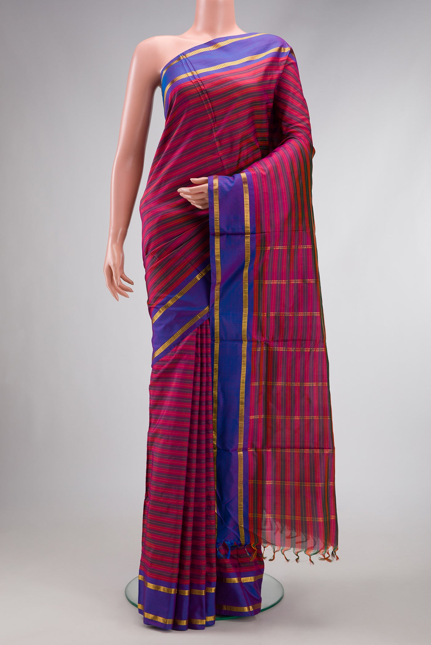 Pure Silk Pure Zari Purple Dual Tone Kanchipuram Nine Yards Saree with Stripes on the body and Zari Border.  displayed on a mannequin