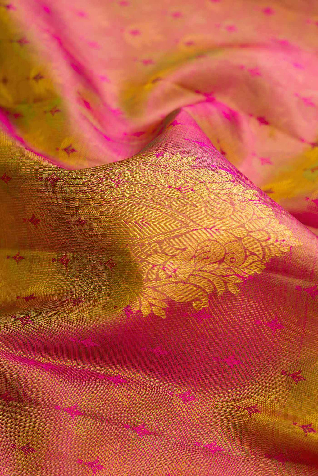 Close up of Mehandi Green Dual Tone Kanchipuram Silk Saree with Jacquard design on the body and Zari Border.  displaying folds