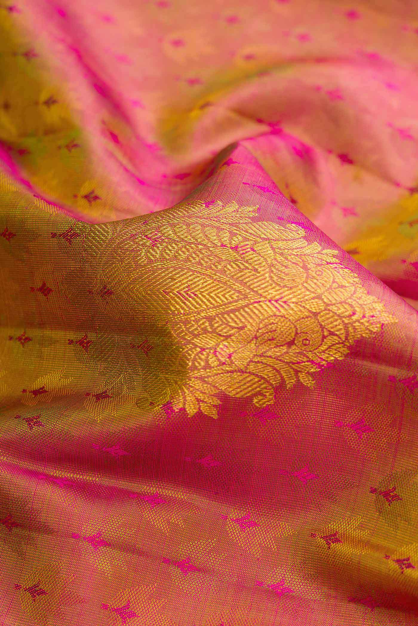 Close up of Mehandi Green Dual Tone Kanchipuram Silk Saree with Jacquard design on the body and Zari Border.  displaying folds
