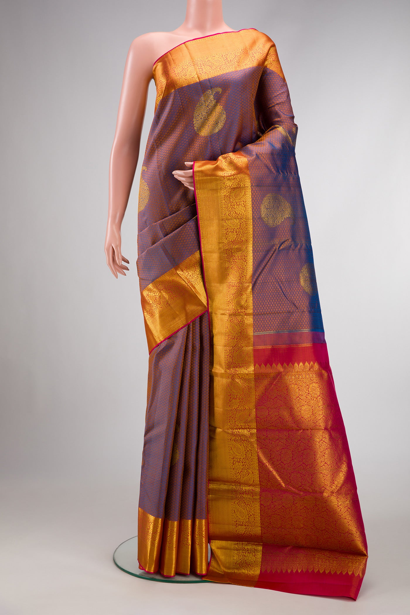 Peacock Blue Dual Tone Kanchipuram Silk Saree with Jacquard With Zari Butta on the body and Zari Border.  displayed on a mannequin