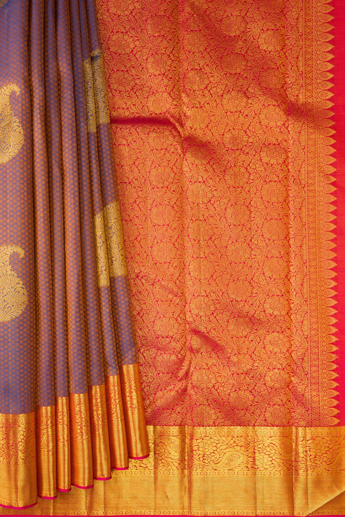 Pleats and pallu of Peacock Blue Dual Tone Kanchipuram Silk Saree with Jacquard With Zari Butta on the body and Zari Border. 
