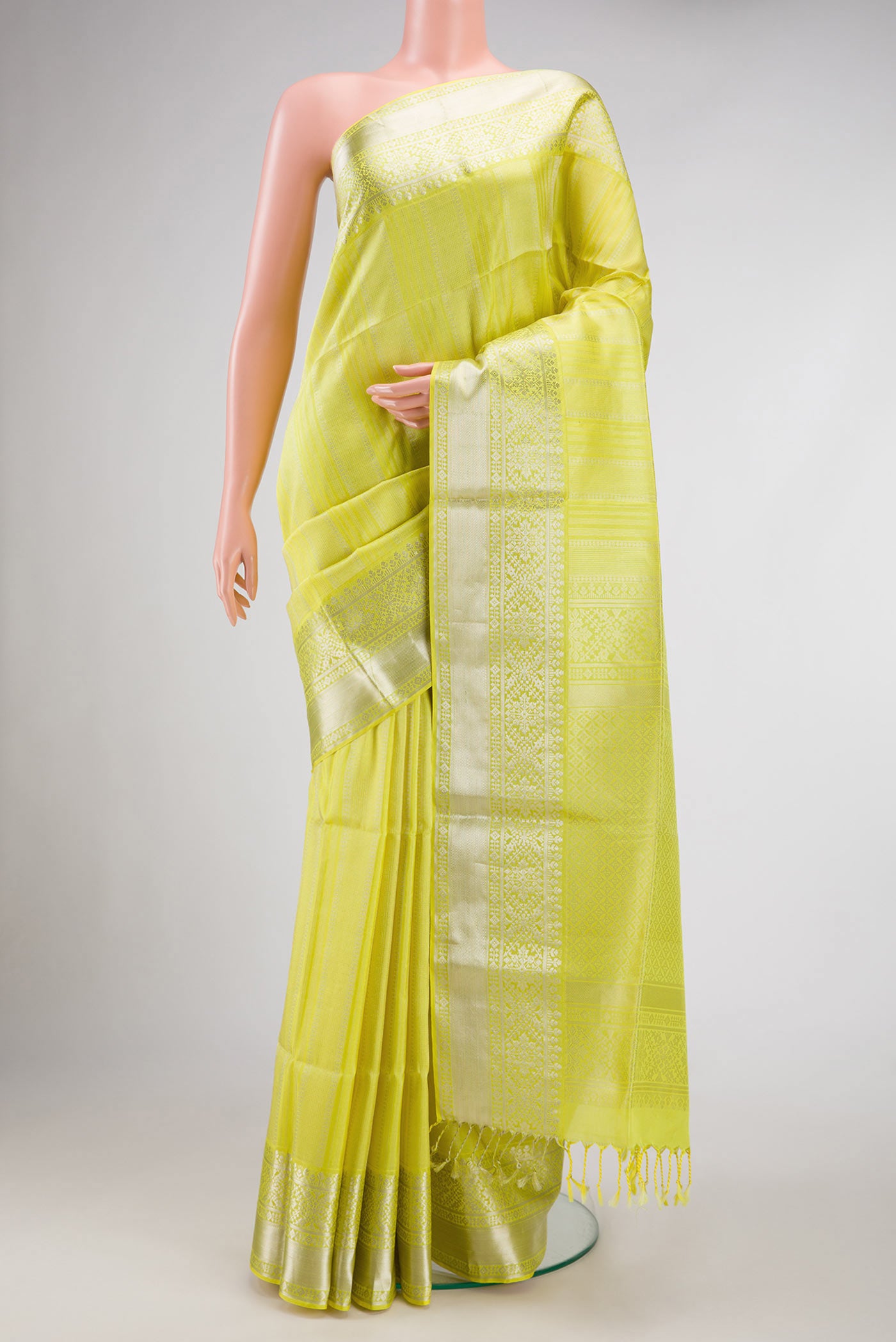 Lemon Yellow Dual Tone Soft Silk Saree with Stripes on the body and Zari Border.  displayed on a mannequin