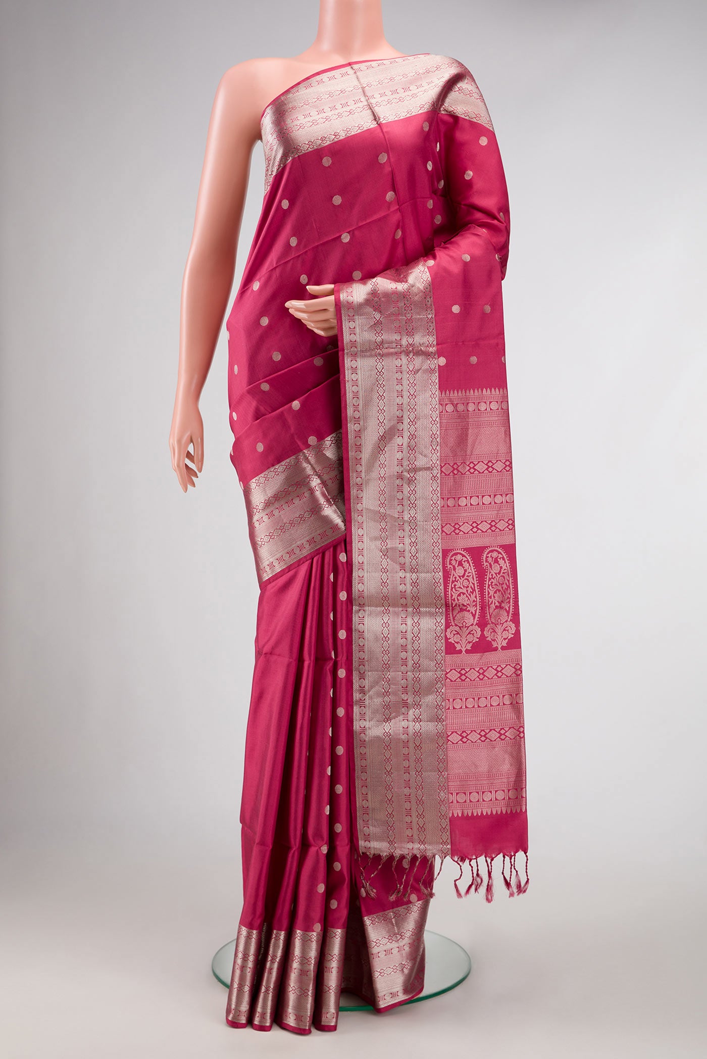 Dark Pink Dual Tone Kanchipuram Silk Saree with Zari Butta on the body and Zari Border.  displayed on a mannequin