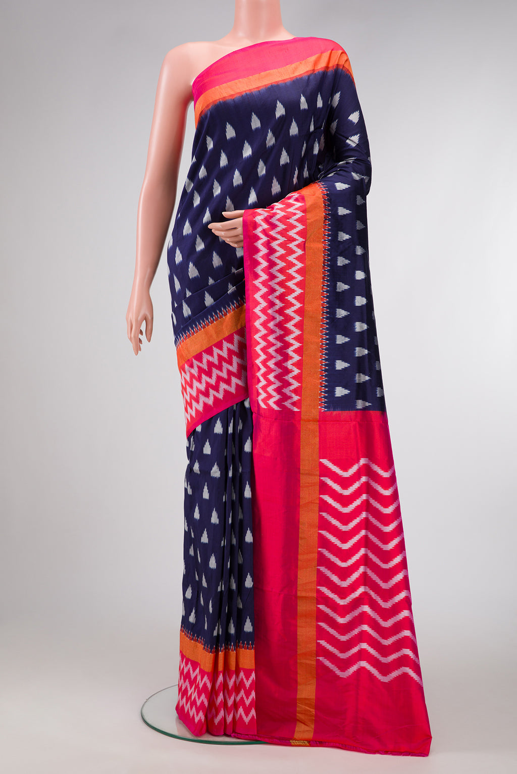 Navy Blue Dual Tone Double Ikat Saree with Ikat Print on the body and Zari Border.  displayed on a mannequin