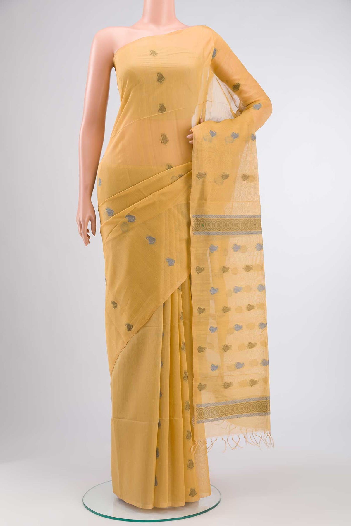 Beige Silk Cotton Saree with Thread Butta on the body and Plain Border displayed on a mannequin