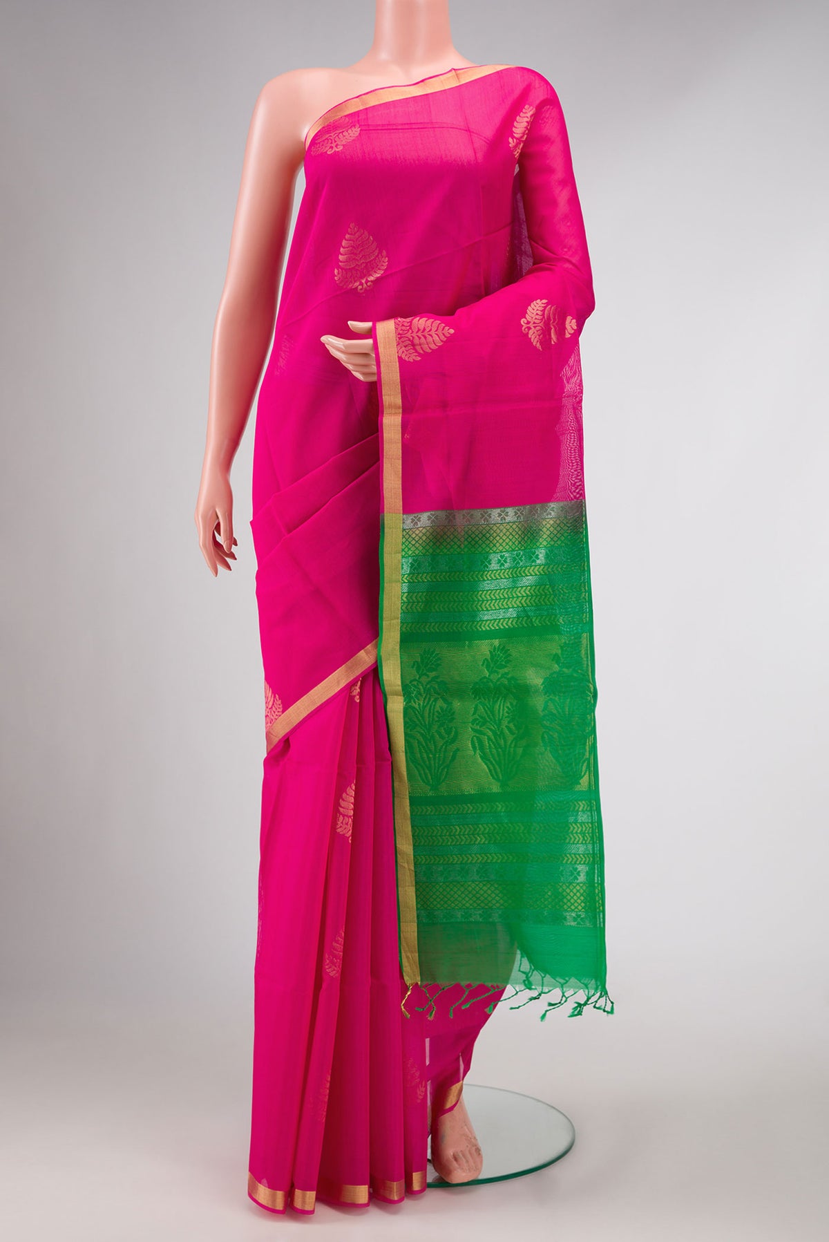 Pink Dual Tone Silk Cotton Saree with Zari Butta on the body and Zari Border displayed on a mannequin