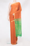 Orange Silk Cotton Saree with Zari Butta on the body and Zari Border.  displayed on a mannequin