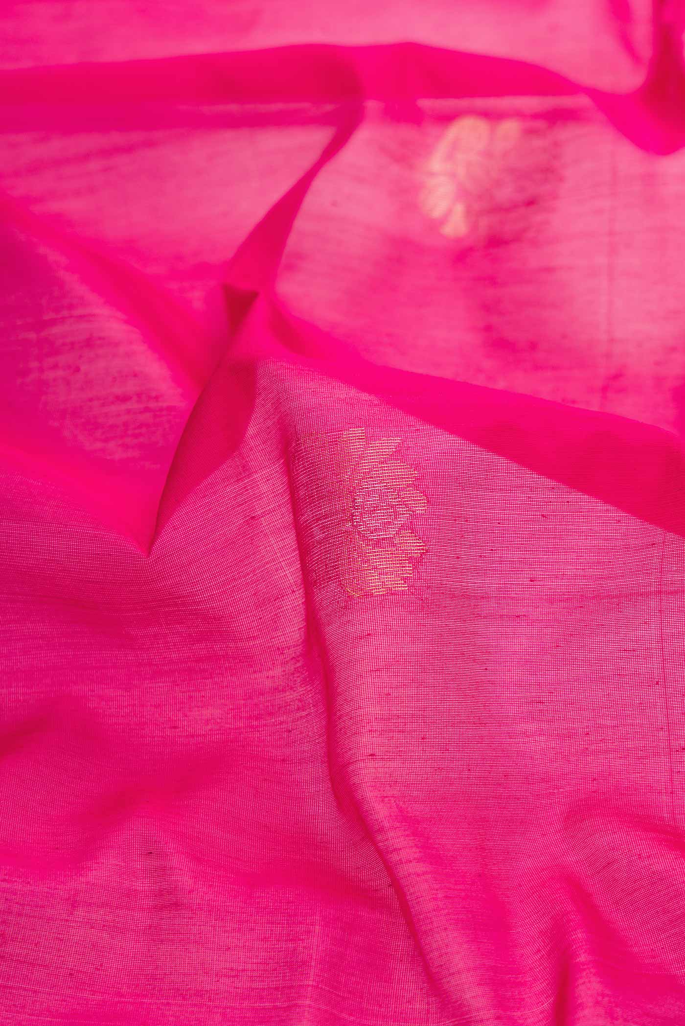 Close up of Pink Dual Tone Silk Cotton Saree with Zari Butta on the body and Zari Border displaying folds