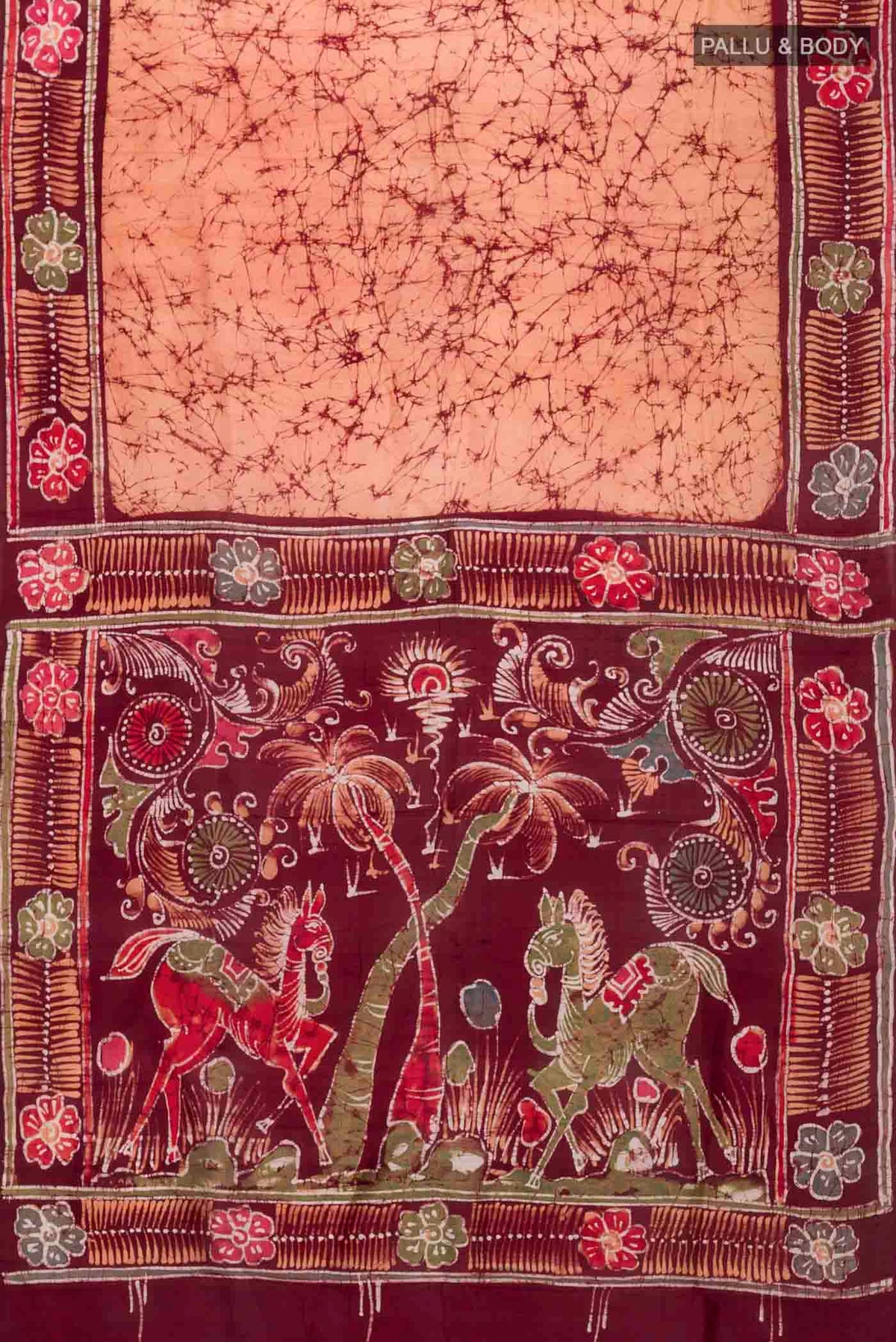 Flat view of Orange Printed Silk Saree with Batik Print on the body and Printed Border