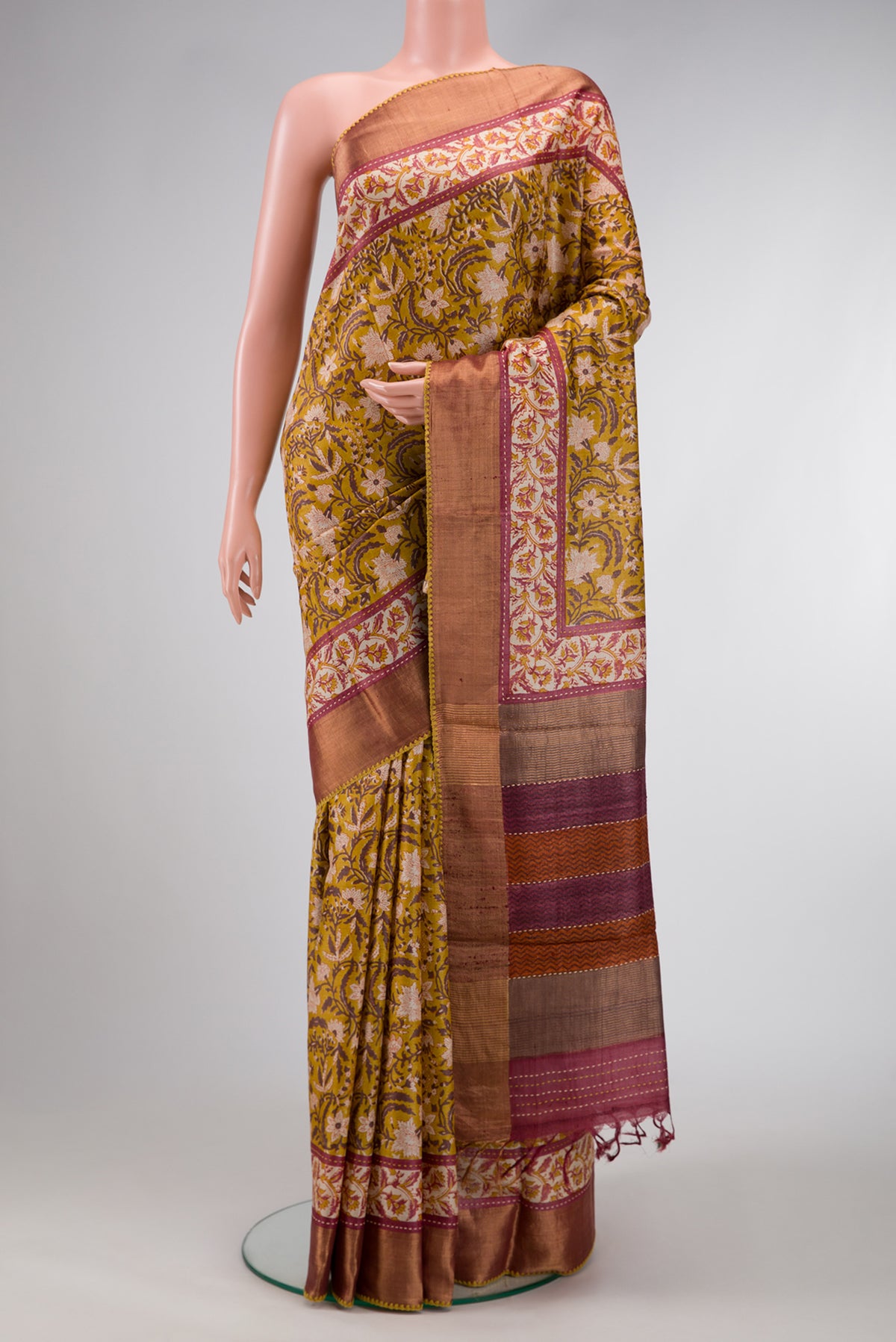 Mehandi Green Dual Tone Tussar Silk Saree with Printed design on the body and Zari Border.  displayed on a mannequin