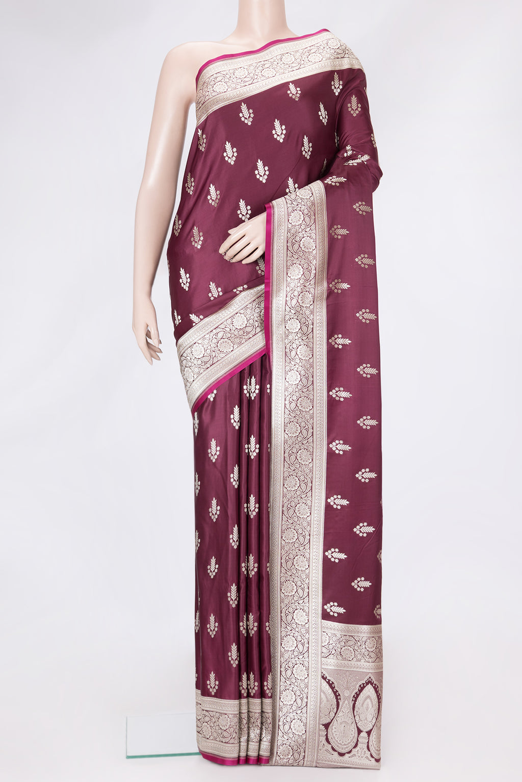 Maroon Dual Tone Banarasi Silk Saree with Zari Butta on the body and Zari Border.  displayed on a mannequin