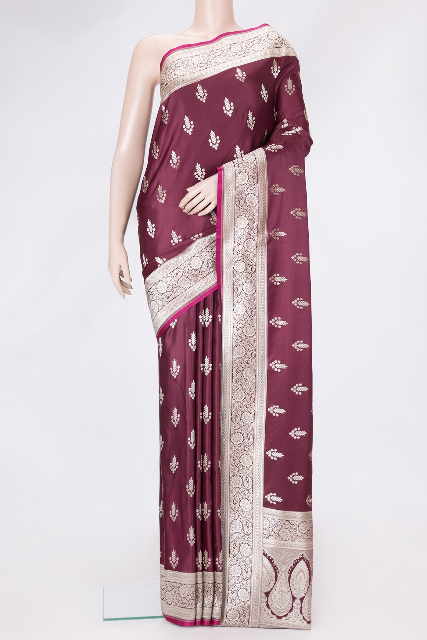 Maroon Dual Tone Banarasi Silk Saree with Zari Butta on the body and Zari Border.  displayed on a mannequin