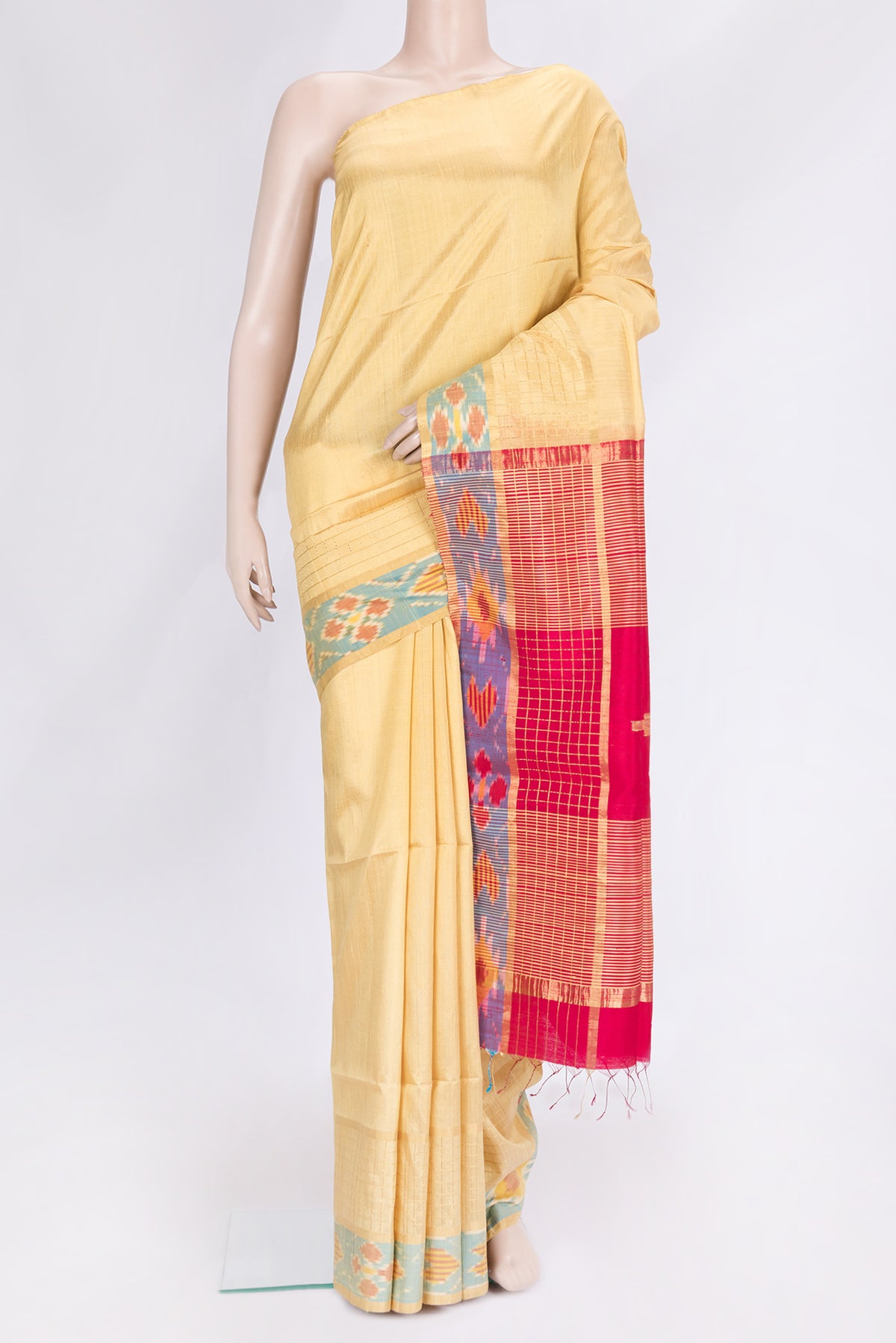Sandal Dual Tone Raw Silk Saree with Plain Body and Ikat Border.  displayed on a mannequin
