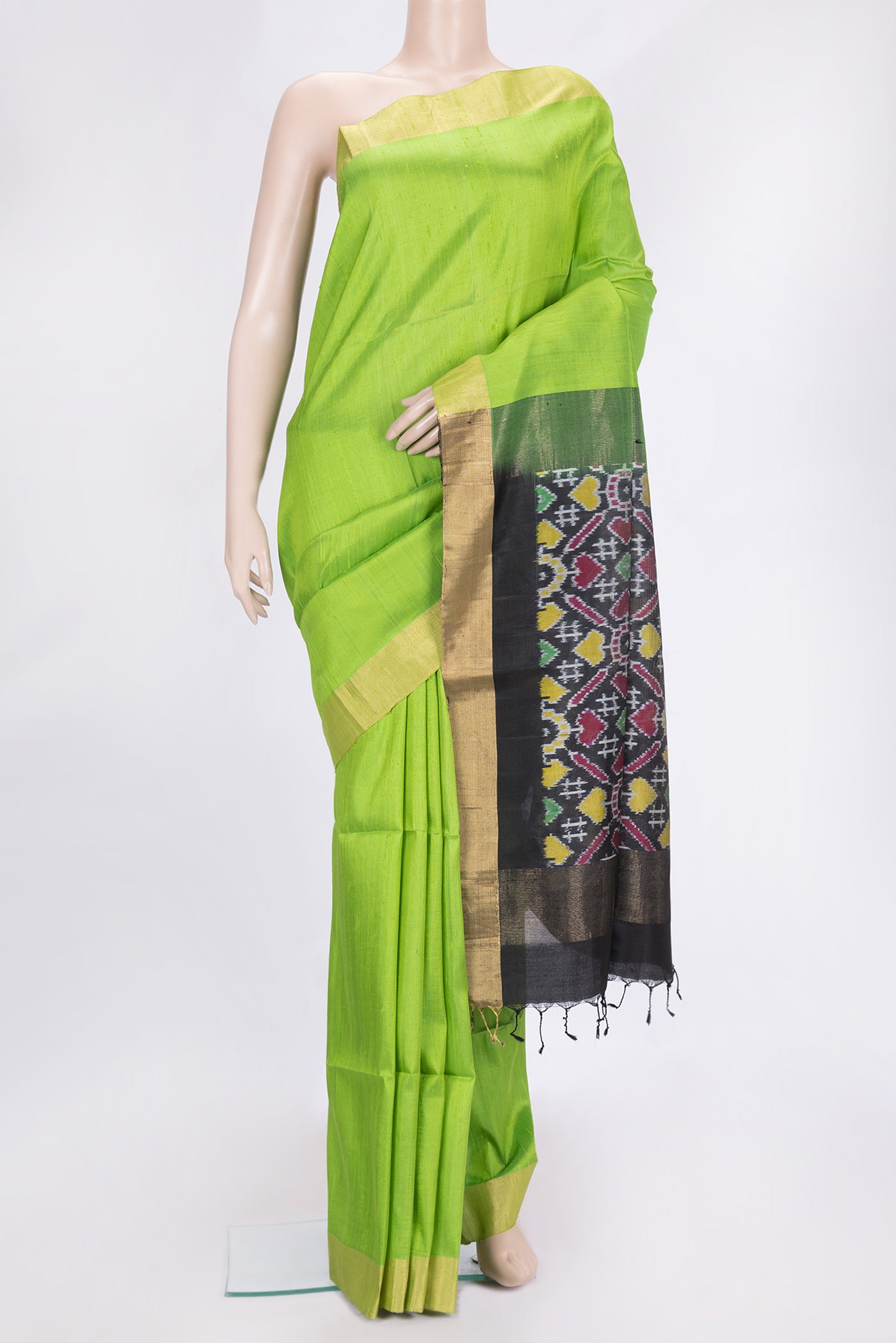 Parrot Green Dual Tone Raw Silk Saree with Plain Body and Zari Border.  displayed on a mannequin