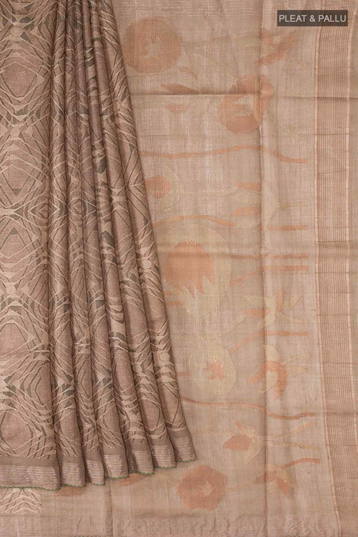 Pleats and pallu of Dark Beige Tussar Silk Saree with Printed design on the body and Zari Border