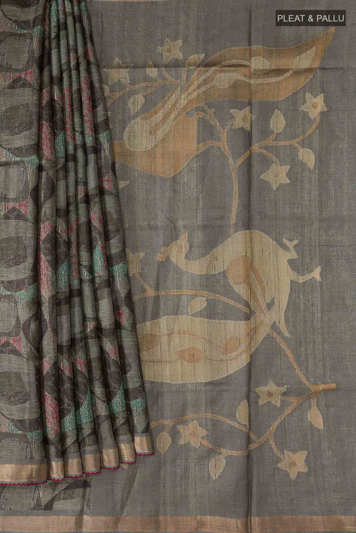 Pleats and pallu of Green Tussar Silk SareePrinted design on the body and Zari Border