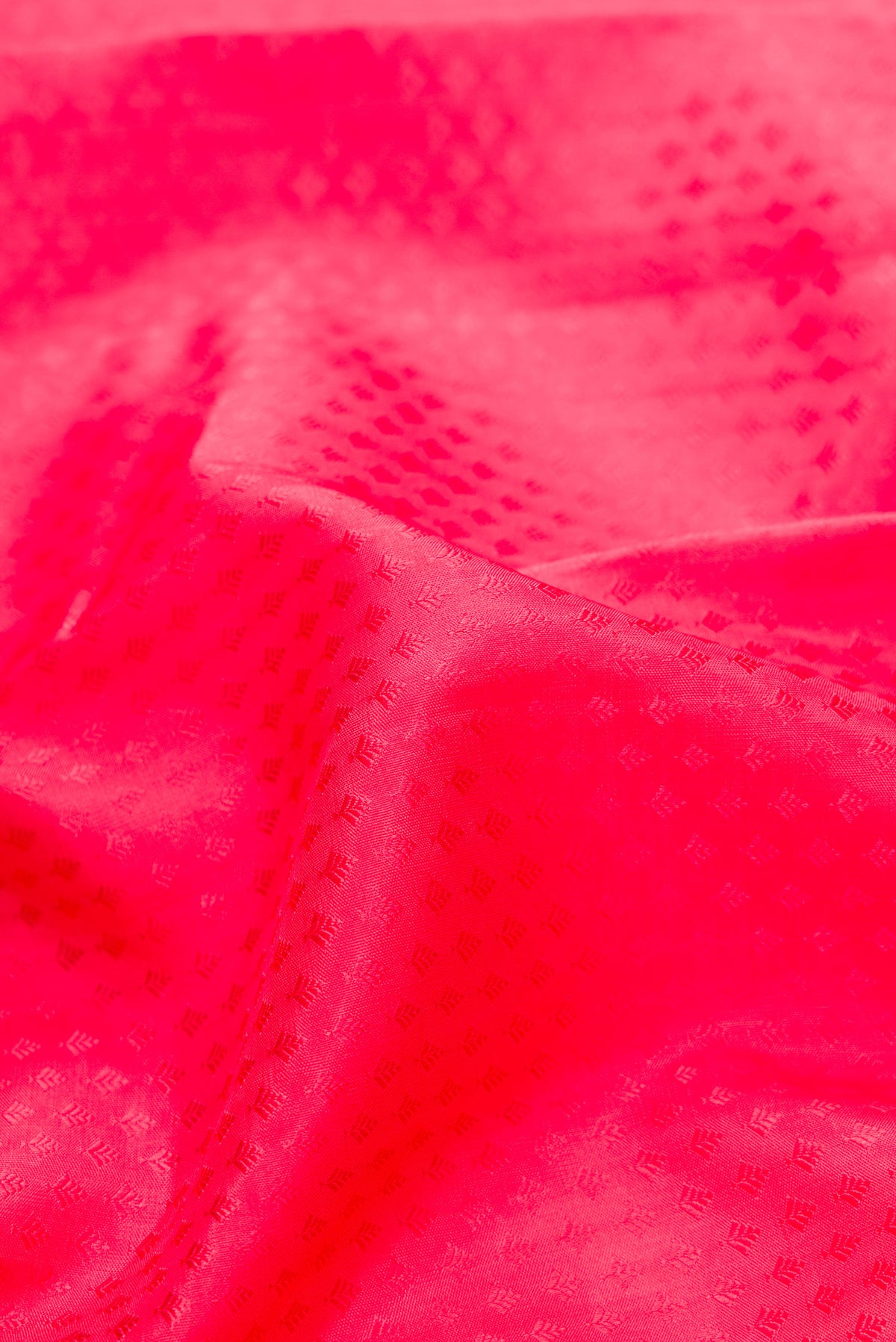 Close up of Pure Silk Pure Zari Pink Dual Tone Kanjivaram Saree with Jacquard design on the body and Zari Border.  displaying folds
