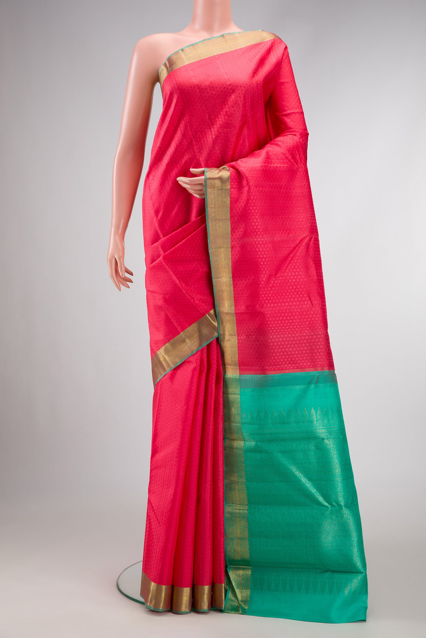 Pure Silk Pure Zari Pink Dual Tone Kanjivaram Saree with Jacquard design on the body and Zari Border.  displayed on a mannequin