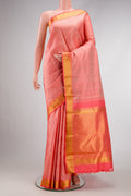 Peach Dual Tone Kanchipuram Silk Saree with Jacquard design on the body and Zari Border.  displayed on a mannequin