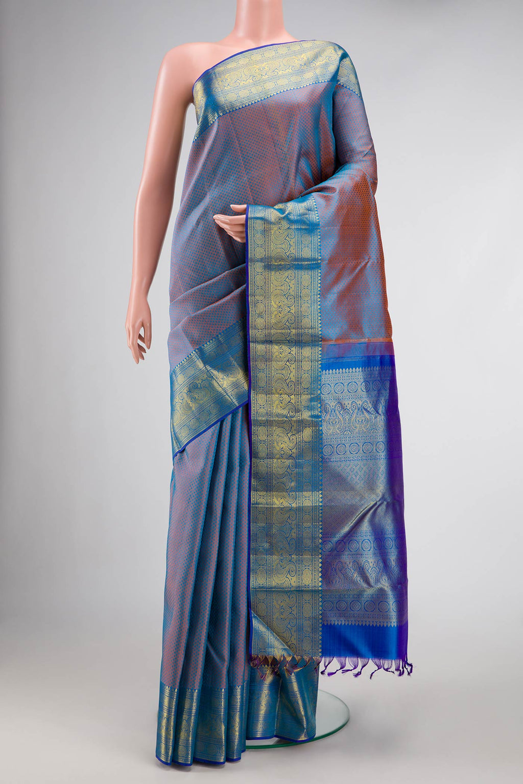 Peacock Blue Dual Tone Kanchipuram Silk Saree with Jacquard design on the body and Zari Border.  displayed on a mannequin