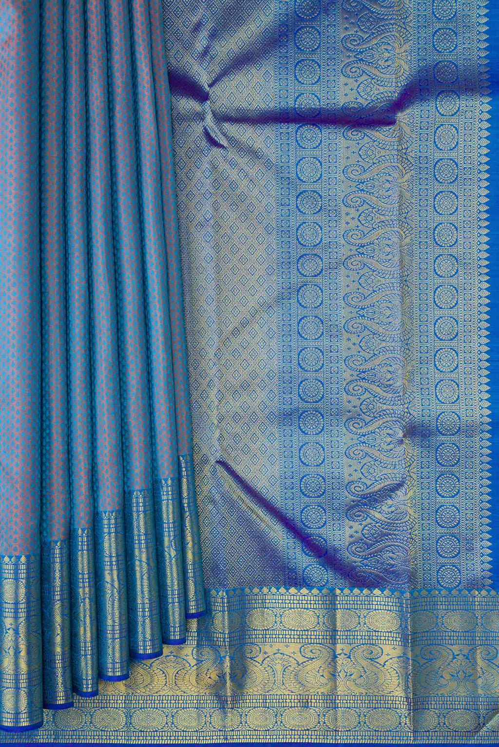 Pleats and pallu of Peacock Blue Dual Tone Kanchipuram Silk Saree with Jacquard design on the body and Zari Border. 