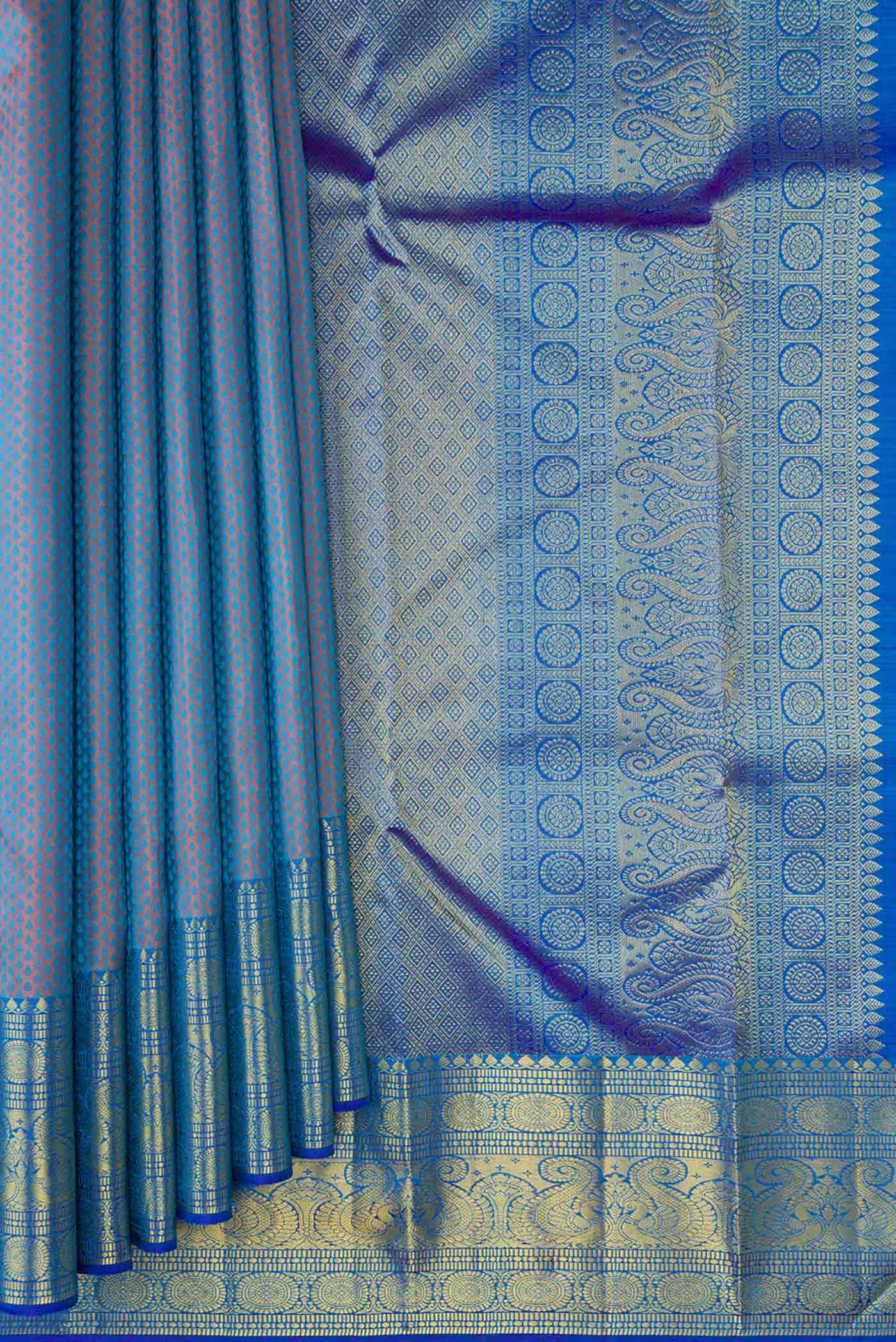 Pleats and pallu of Peacock Blue Dual Tone Kanchipuram Silk Saree with Jacquard design on the body and Zari Border. 