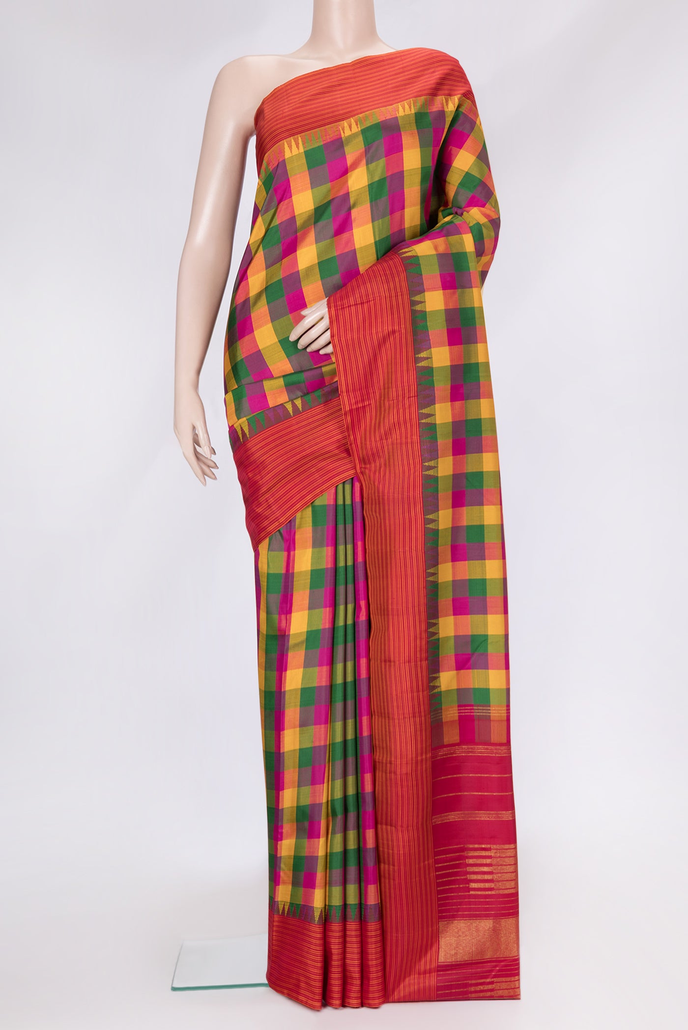 Mustard, Green and Pink Color Kanchipuram Silk Saree with Checked design on the body and Thread Border.  displayed on a mannequin