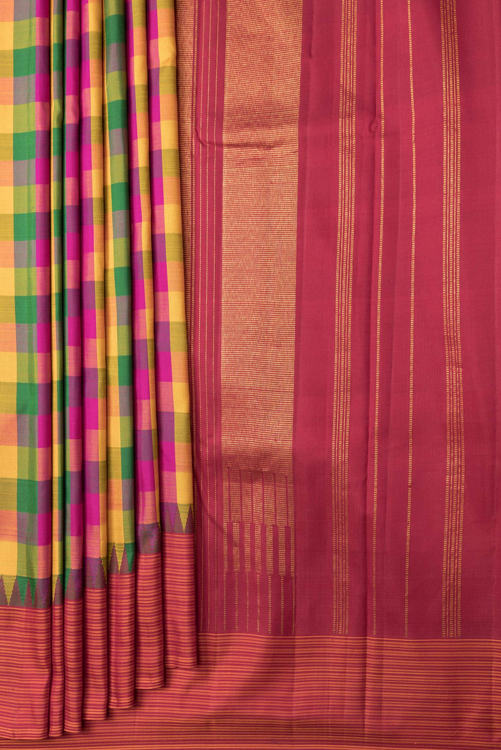 Pleats and pallu of Mustard, Green and Pink Color Kanchipuram Silk Saree with Checked design on the body and Thread Border. 