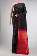 Black Dual Tone Kanjivaram Silk Saree with Stripes on the body and Plain Border.  displayed on a mannequin