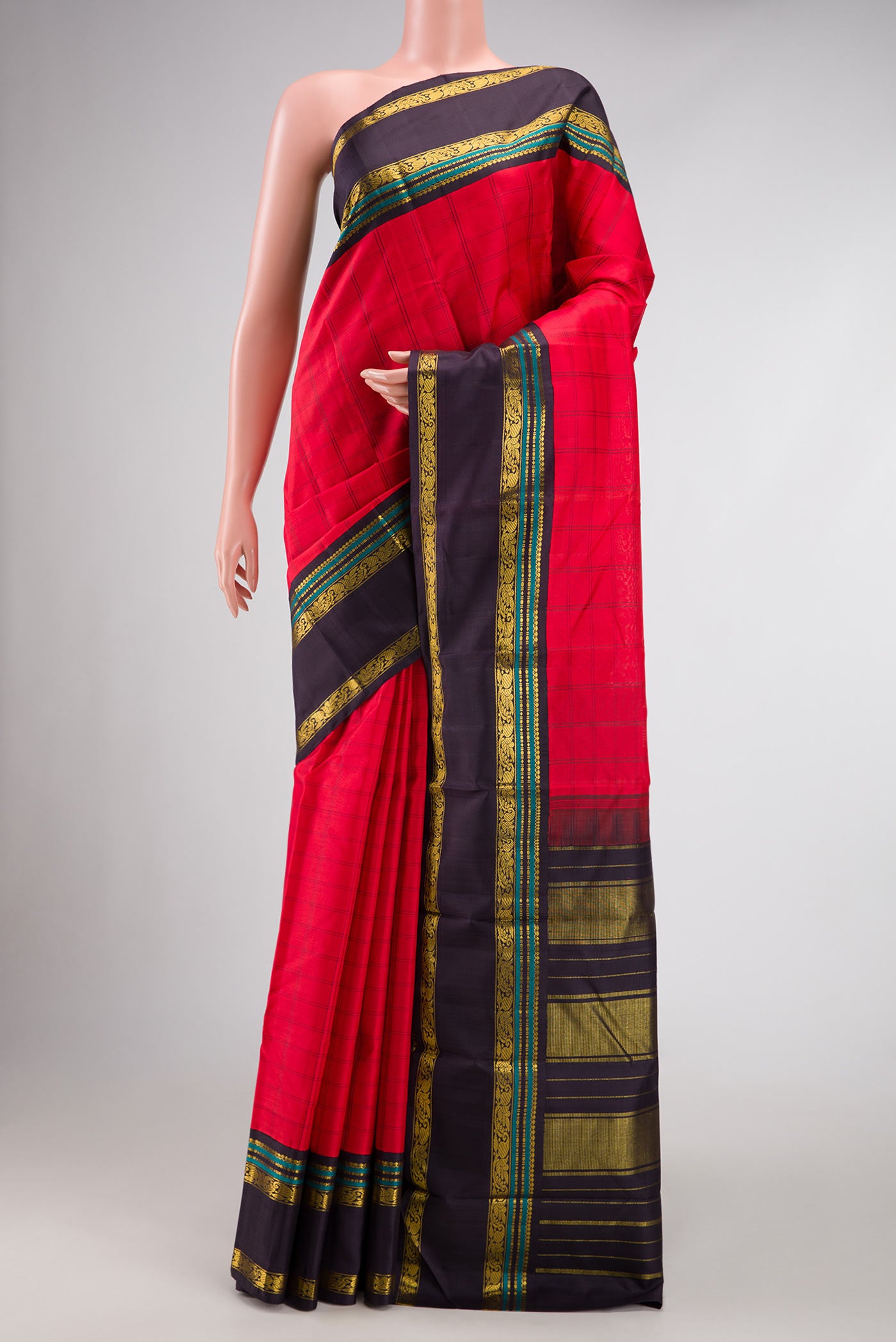 Red Dual Tone Kanjivaram Silk Saree with Checked design on the body and Zari Border.  displayed on a mannequin