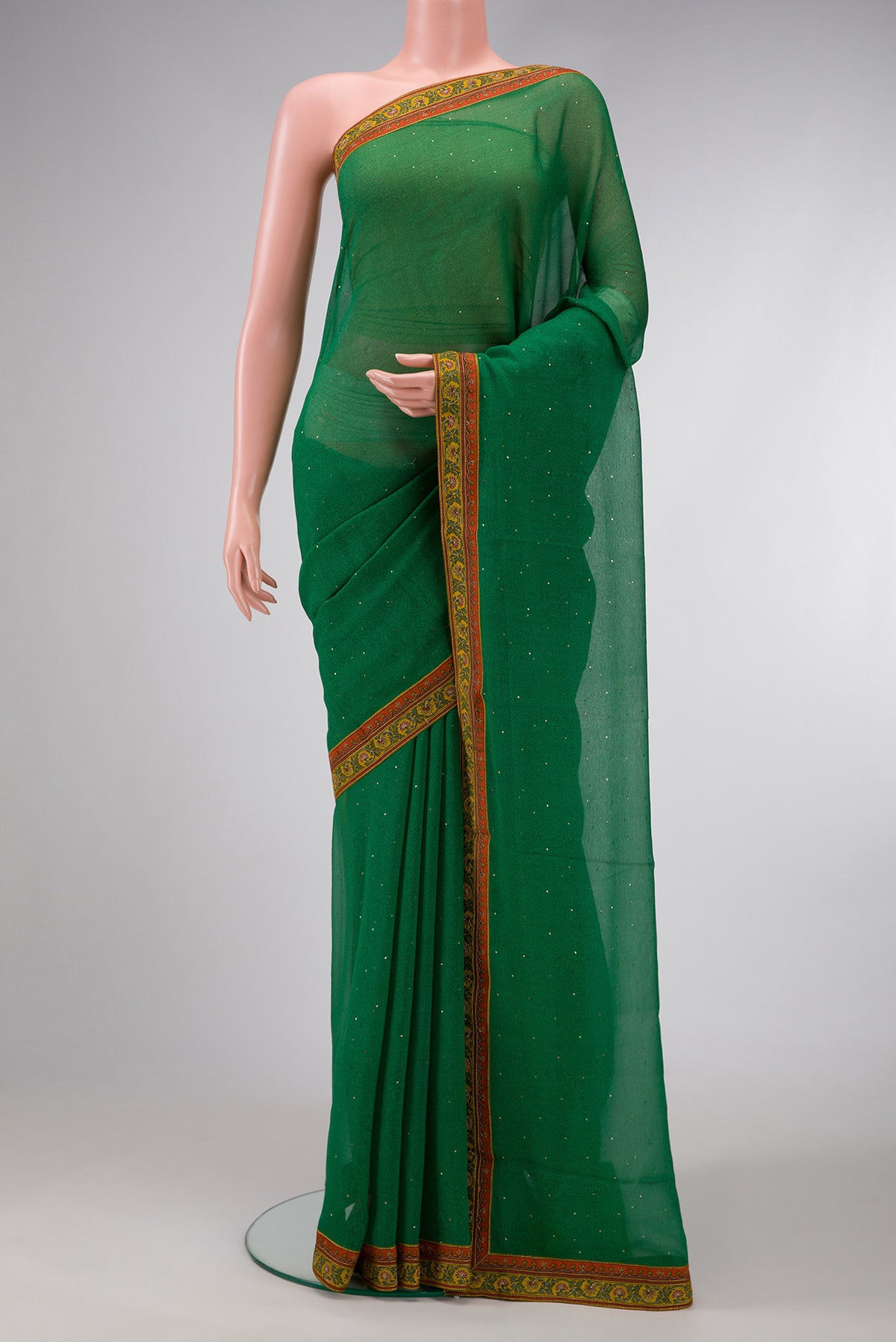 Green Dual Tone Chiffon Saree with Embroidery on the body and Embroidery Border.  displayed on a mannequin