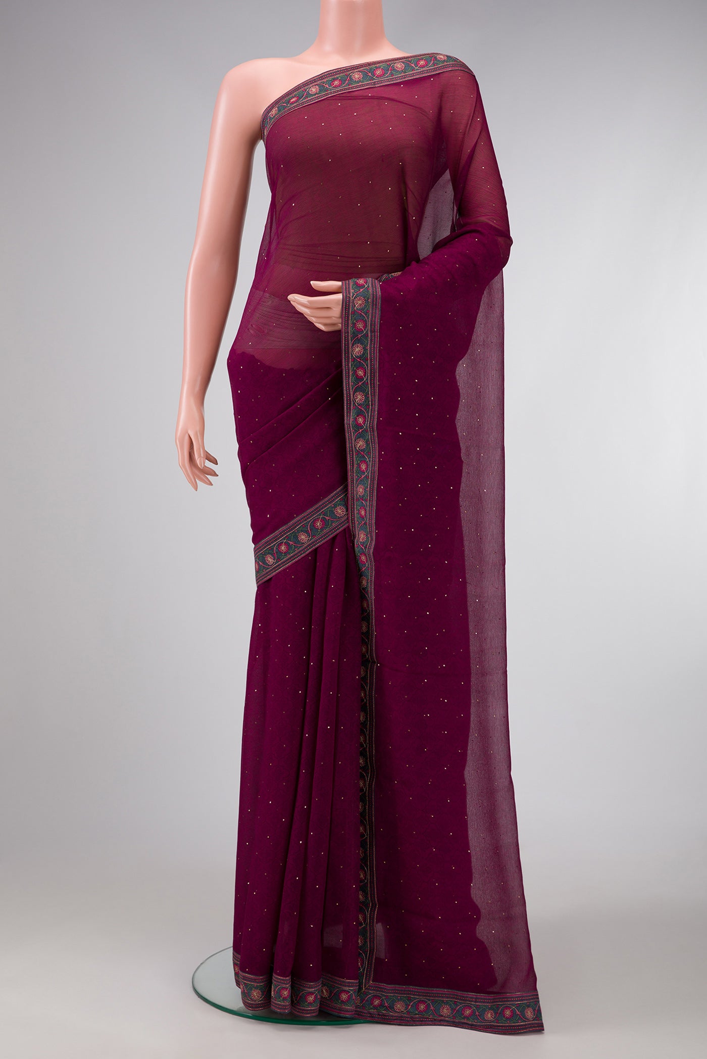 Maroon Dual Tone Chiffon Saree with Embroidery on the body and Embroidery Border.  displayed on a mannequin