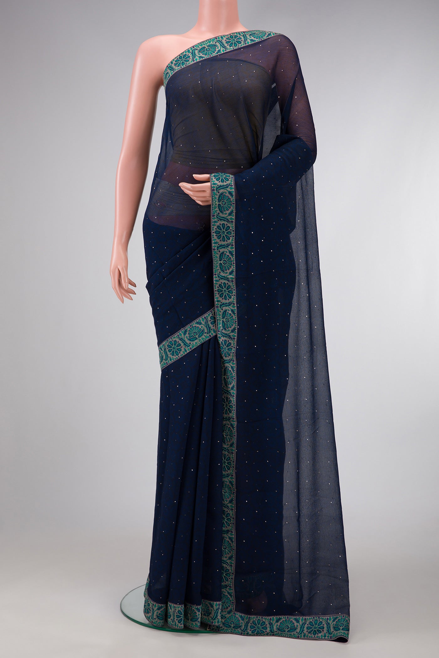 Navy Blue Dual Tone Chiffon Saree with Embroidery on the body and Embroidery Border.  displayed on a mannequin