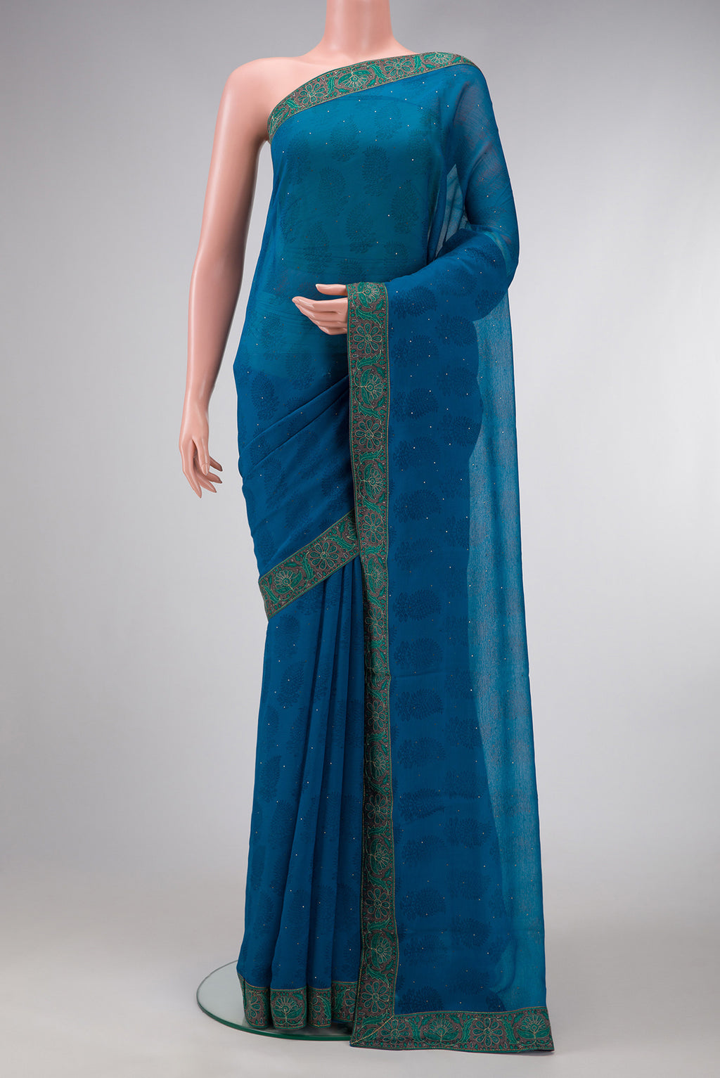 Sky Blue Dual Tone Chiffon Saree with Embroidery on the body and Embroidery Border.  displayed on a mannequin