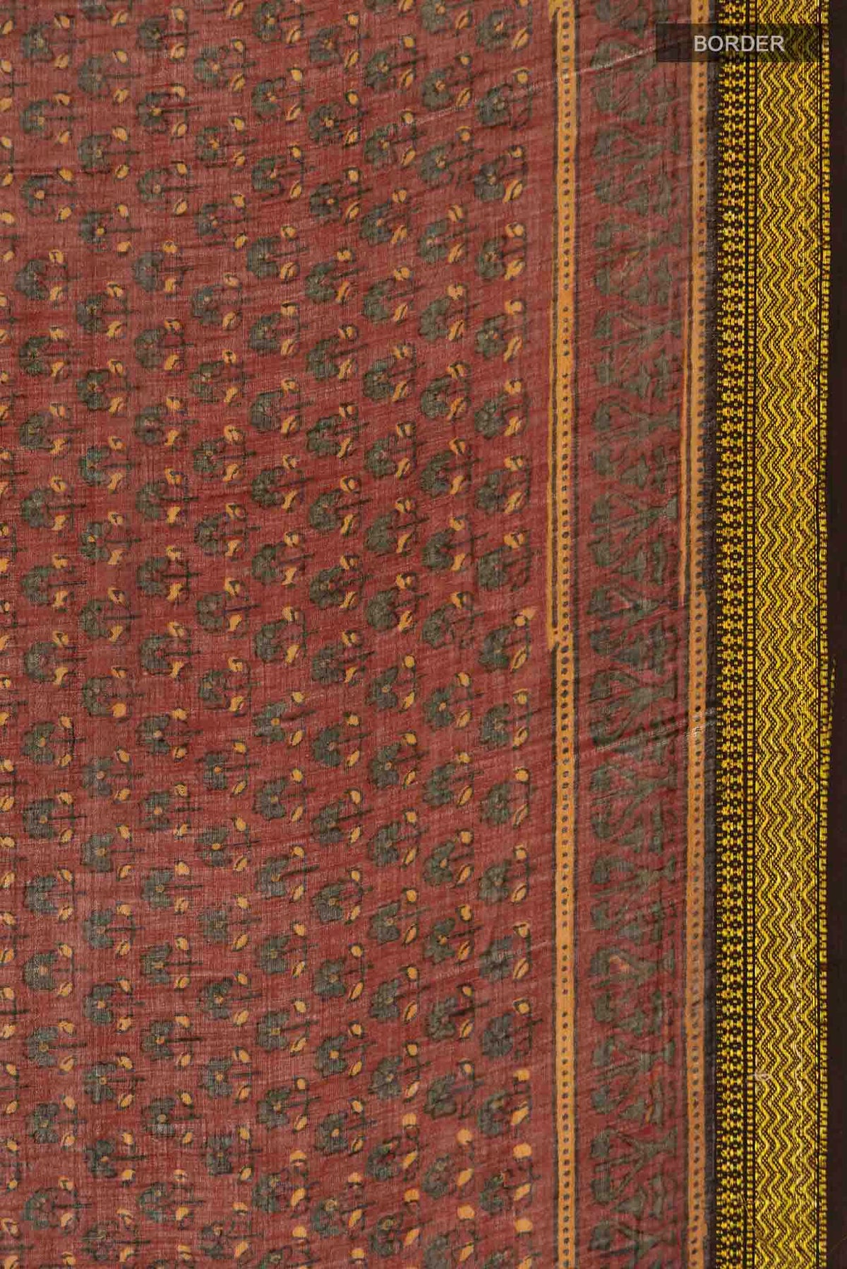 Border image of Rust Chanderi Silk Cotton SareePrinted design on the body and Zari Border