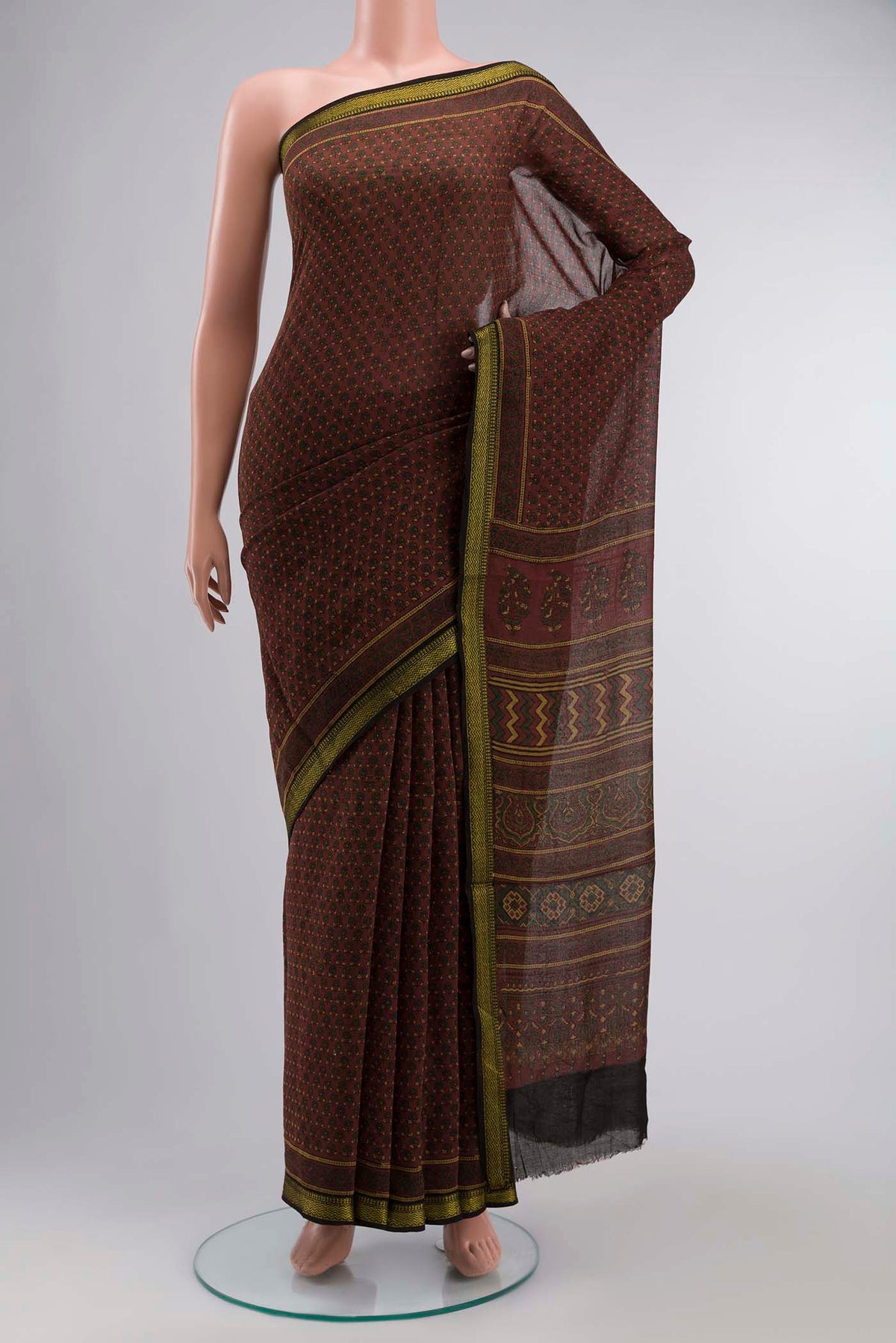 Rust Chanderi Silk Cotton SareePrinted design on the body and Zari Border displayed on a mannequin