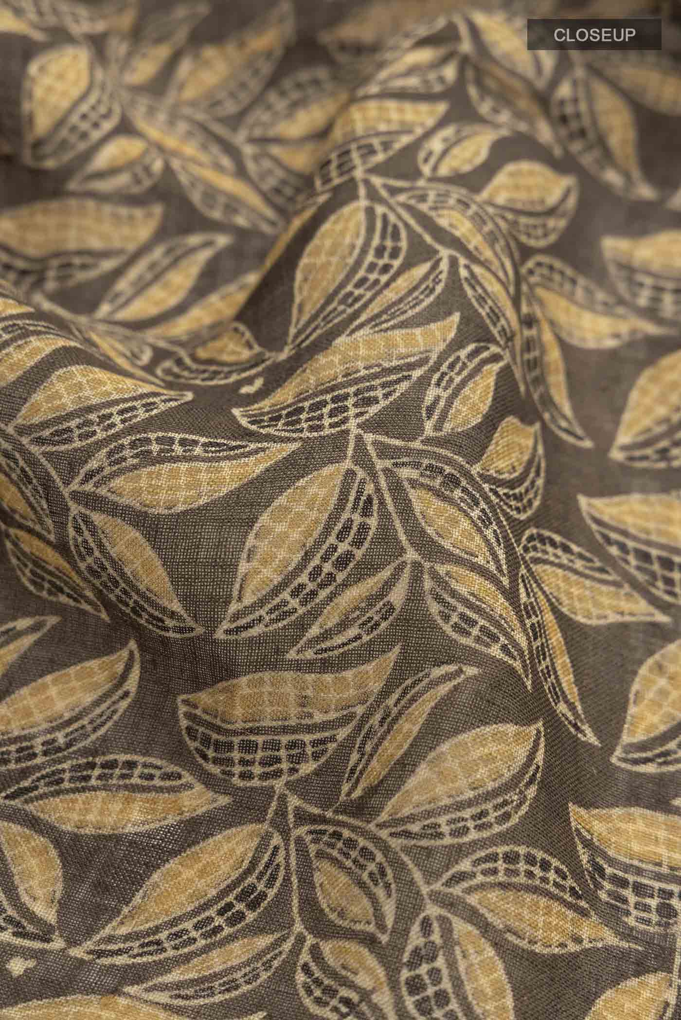 Close up of Green Linen Cotton SareePrinted design on the body and Zari Border displaying folds