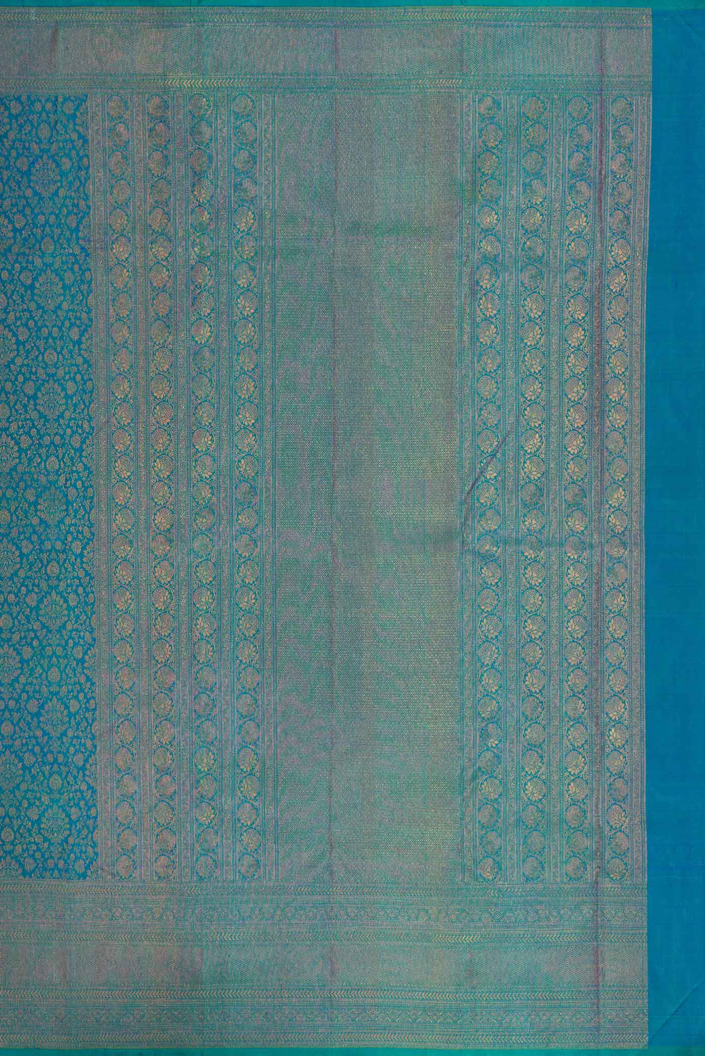 Close up image of the pallu of Peacock Blue Dual Tone Kanjivaram Silk Saree with Zari Brocade on the body and Zari Border. 