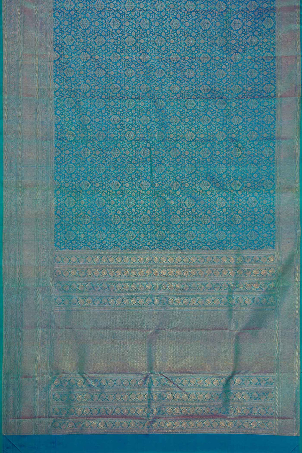 Flat view of Peacock Blue Dual Tone Kanjivaram Silk Saree with Zari Brocade on the body and Zari Border. 